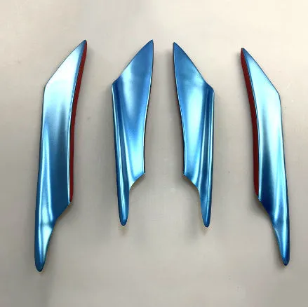 Set of four ABS plastic bumper air knife spoilers in a carbon fibre finish for car modification.