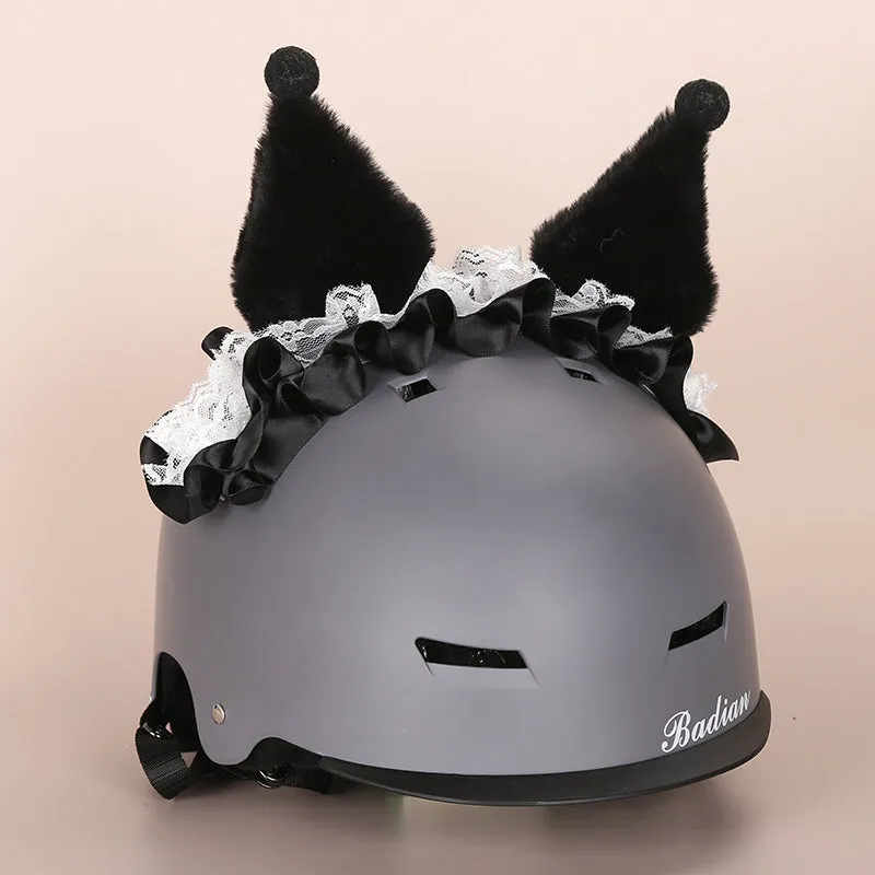 A soft plush cartoon character cover placed over a ski helmet on a snowy background.