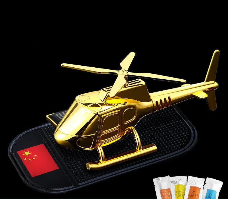 Helicopter car interior decoration model in silver colour on car dashboard
