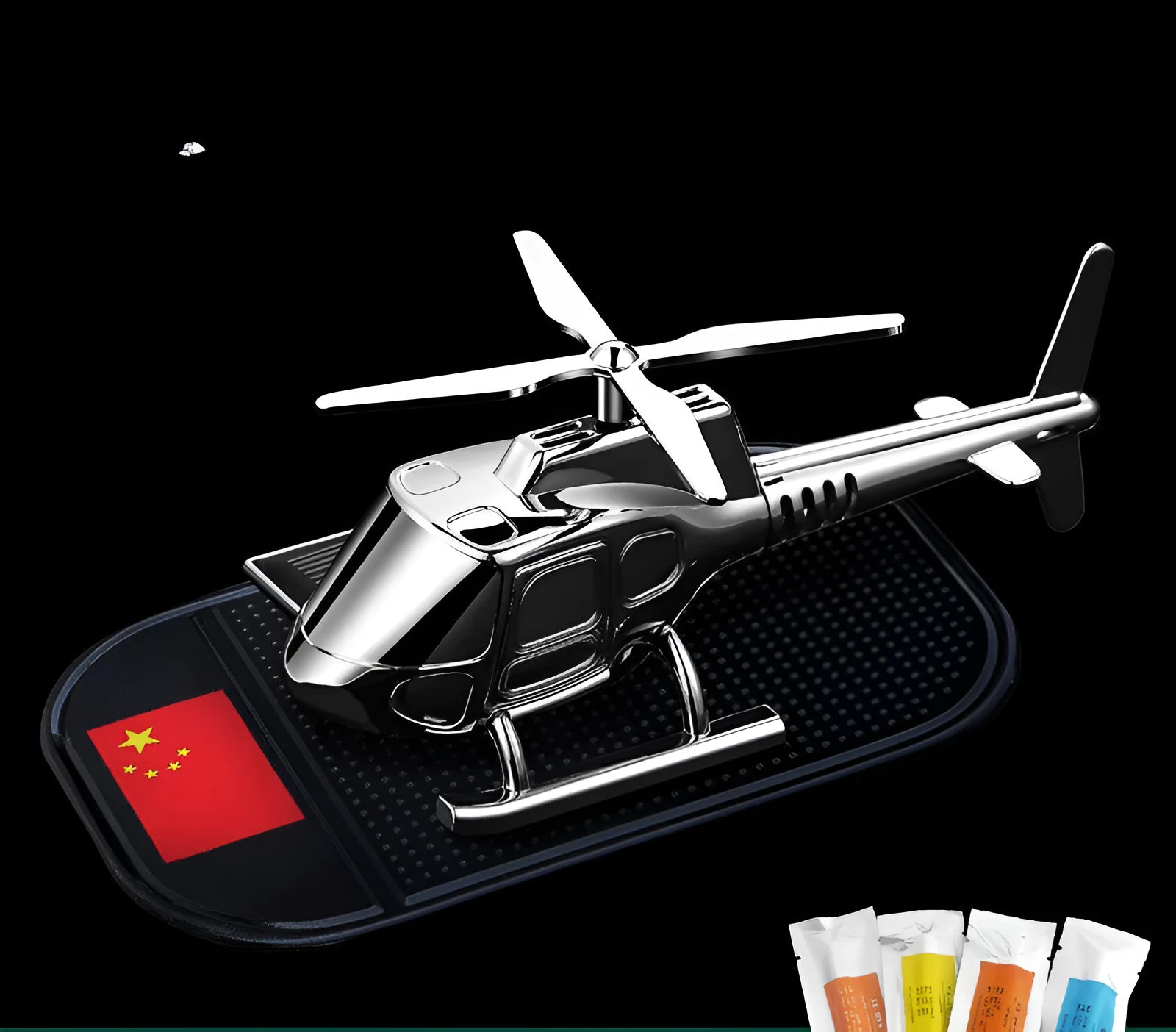 Helicopter car interior decoration model in silver colour on car dashboard