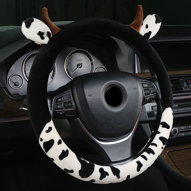 Short plush steering wheel cover with protective handle section in black colour