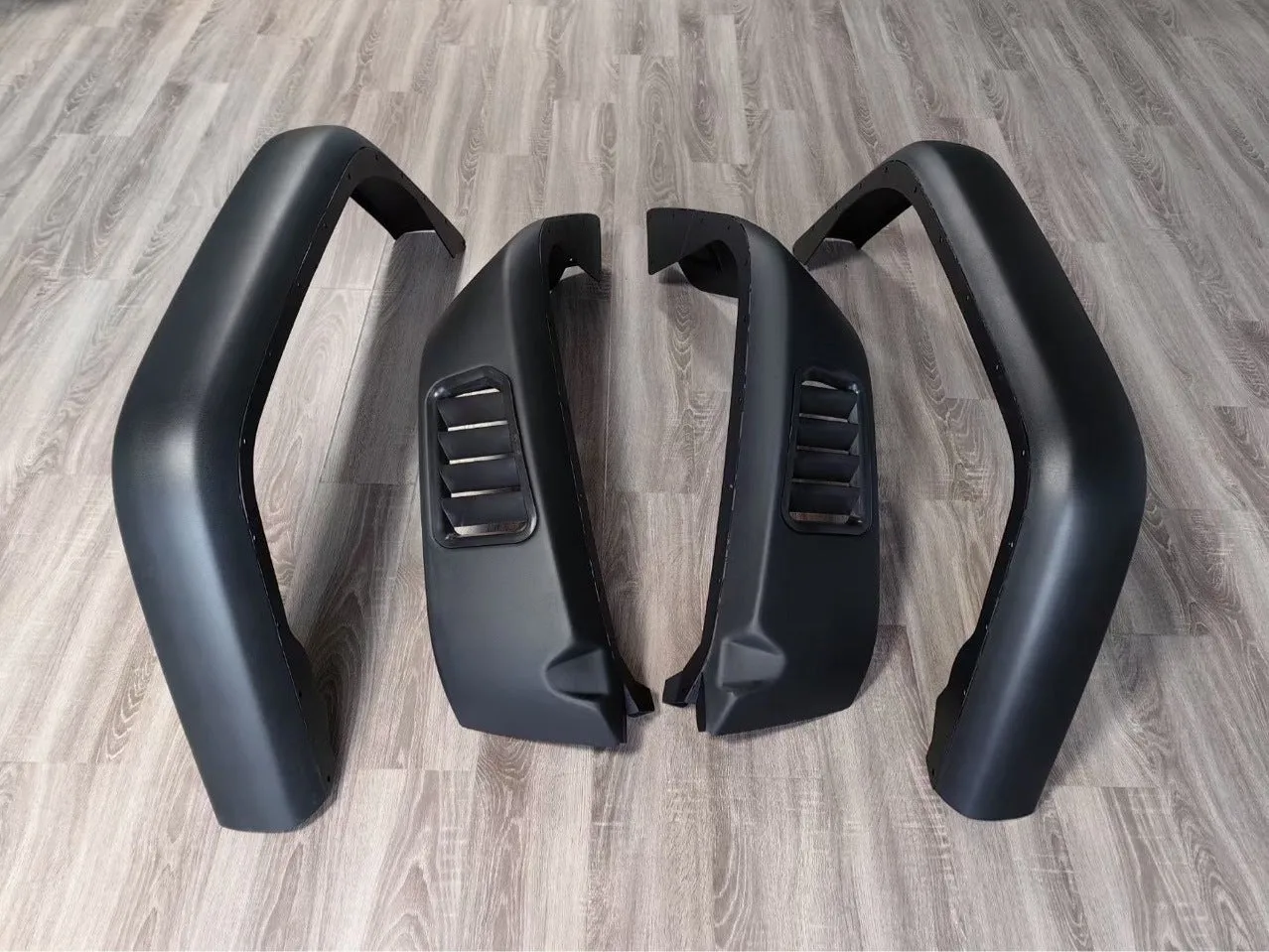 Black plastic car wheel arch set of four for universal fit on automobiles