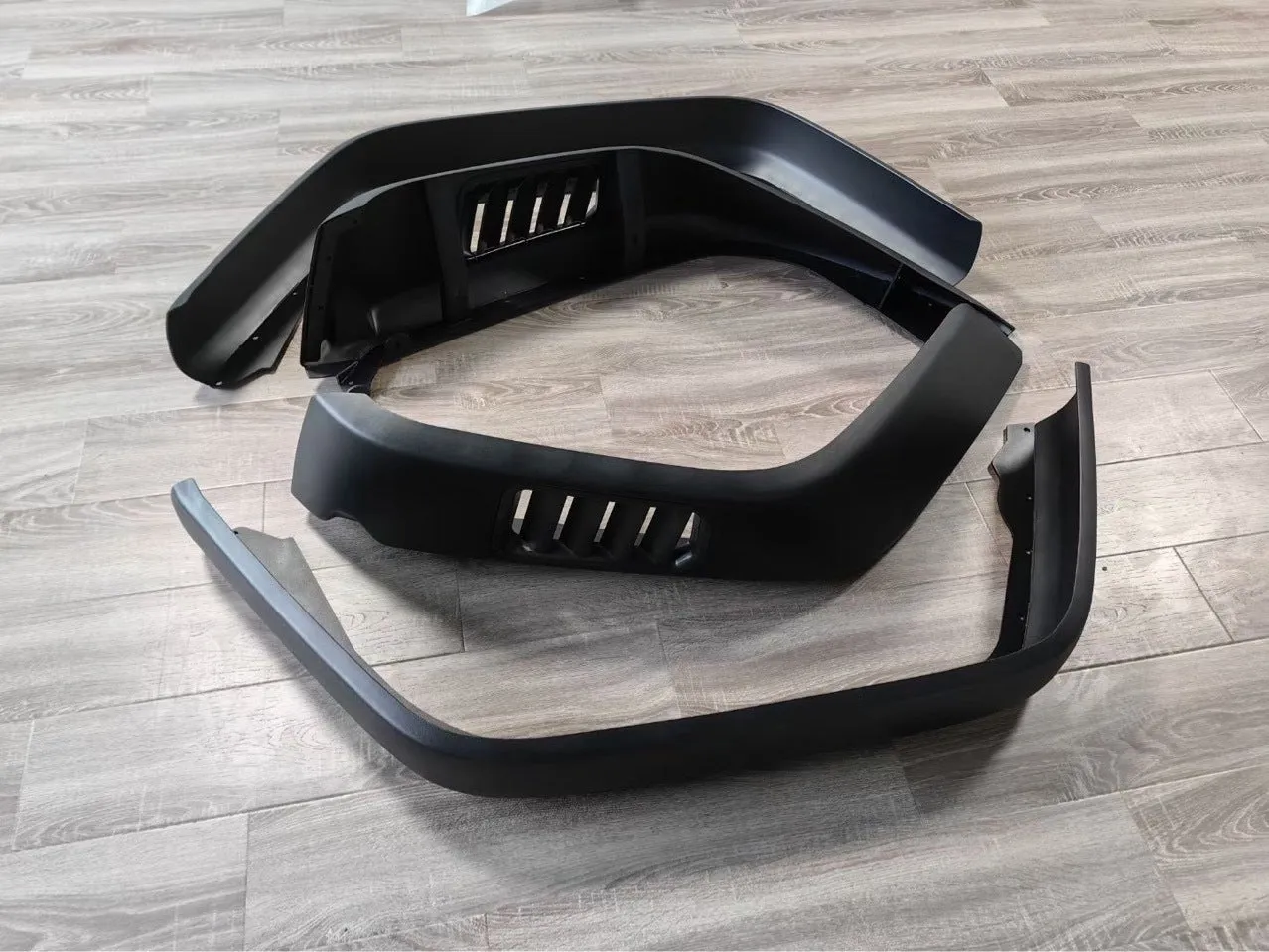 Black plastic car wheel arch set of four for universal fit on automobiles