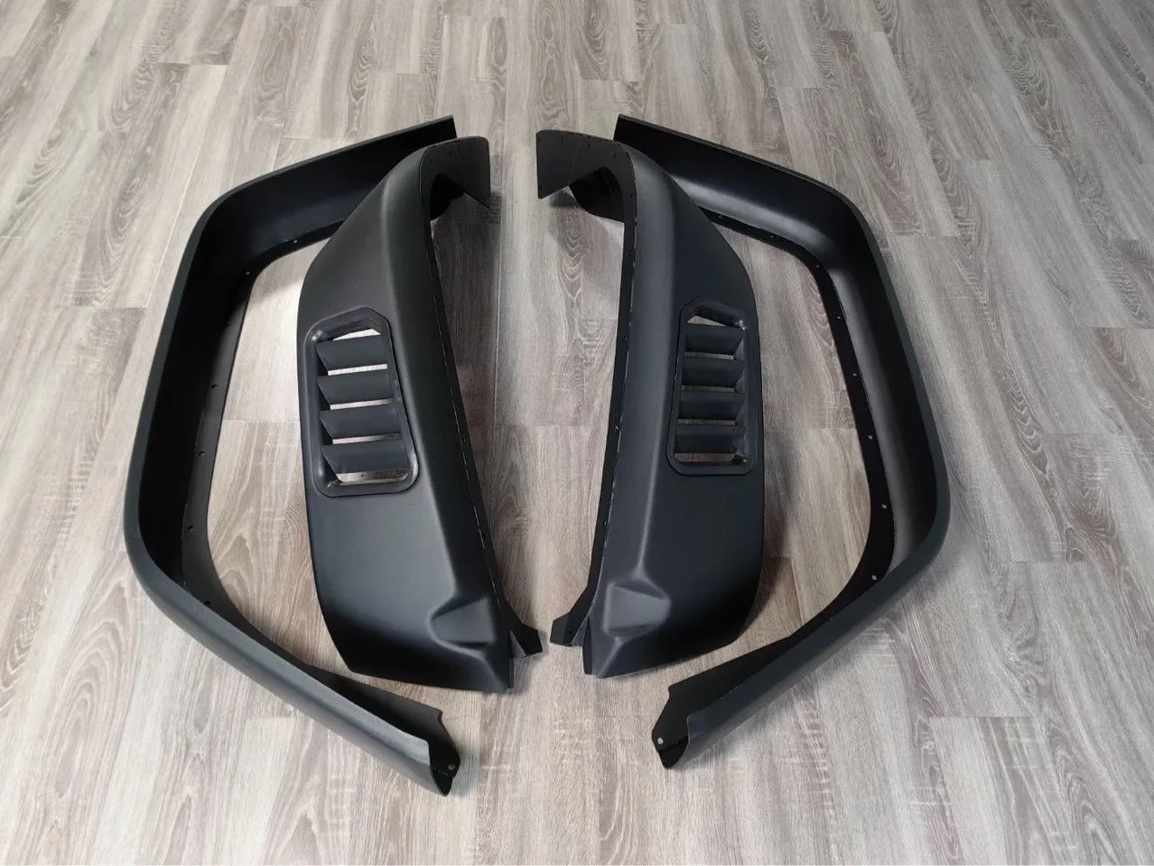Black plastic car wheel arch set of four for universal fit on automobiles