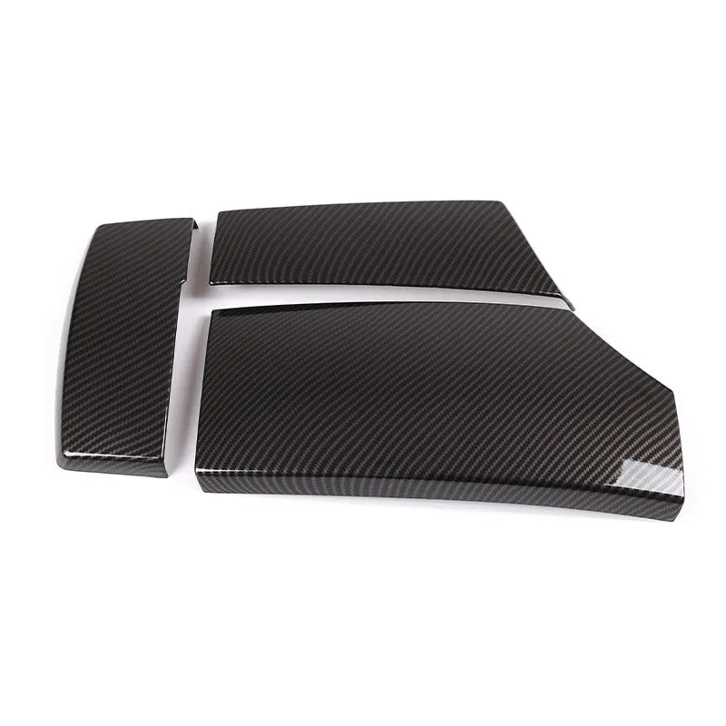 Three black ABS car armrest protective covers with a shiny diagonal carbon fibre weave pattern.