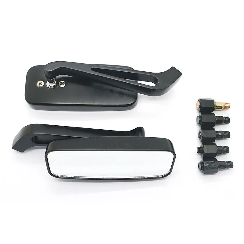 Pair of motorcycle rearview mirrors with glass surface and aluminium alloy cover in retro decor setting