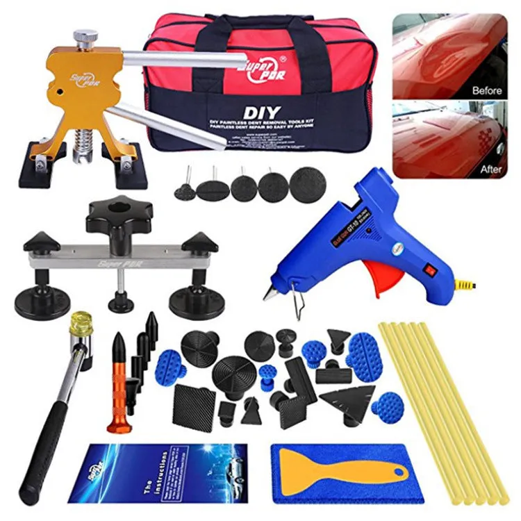 Car dent repair puller kit with glue gun and adhesive sticks in carton packaging