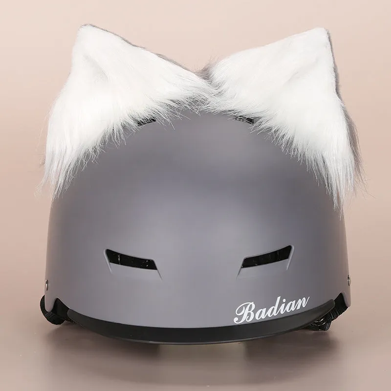 A plush fabric helmet cover with cartoon print and 3D ears, next to a matching beanie hat, on a neutral background.