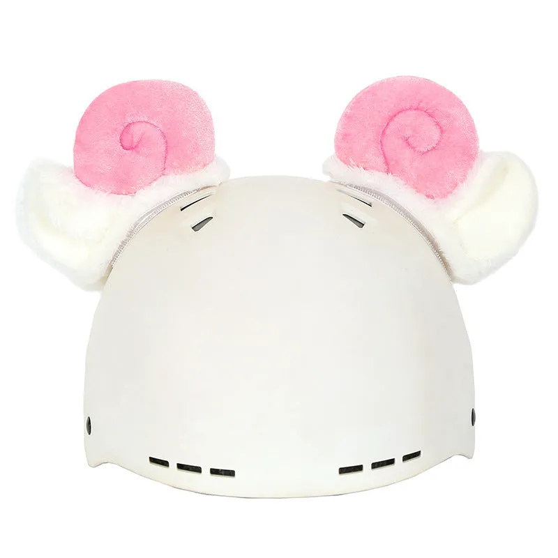 A plush fabric helmet cover with cartoon print and 3D ears, next to a matching beanie hat, on a neutral background.