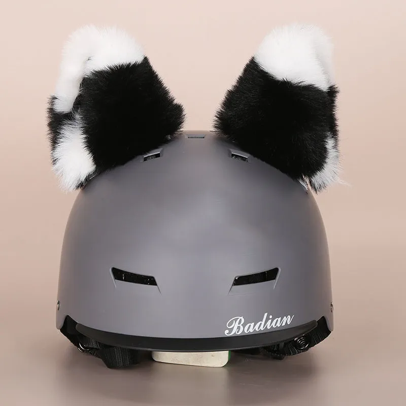 A plush fabric helmet cover with cartoon print and 3D ears, next to a matching beanie hat, on a neutral background.