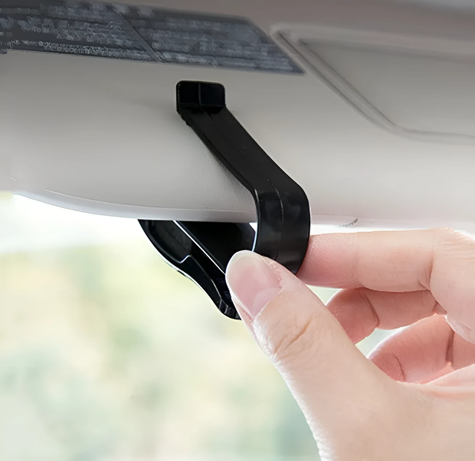 Black plastic car sunshade clip for holding glasses and ID cards, shown next to a ruler showing 6.5cm length.