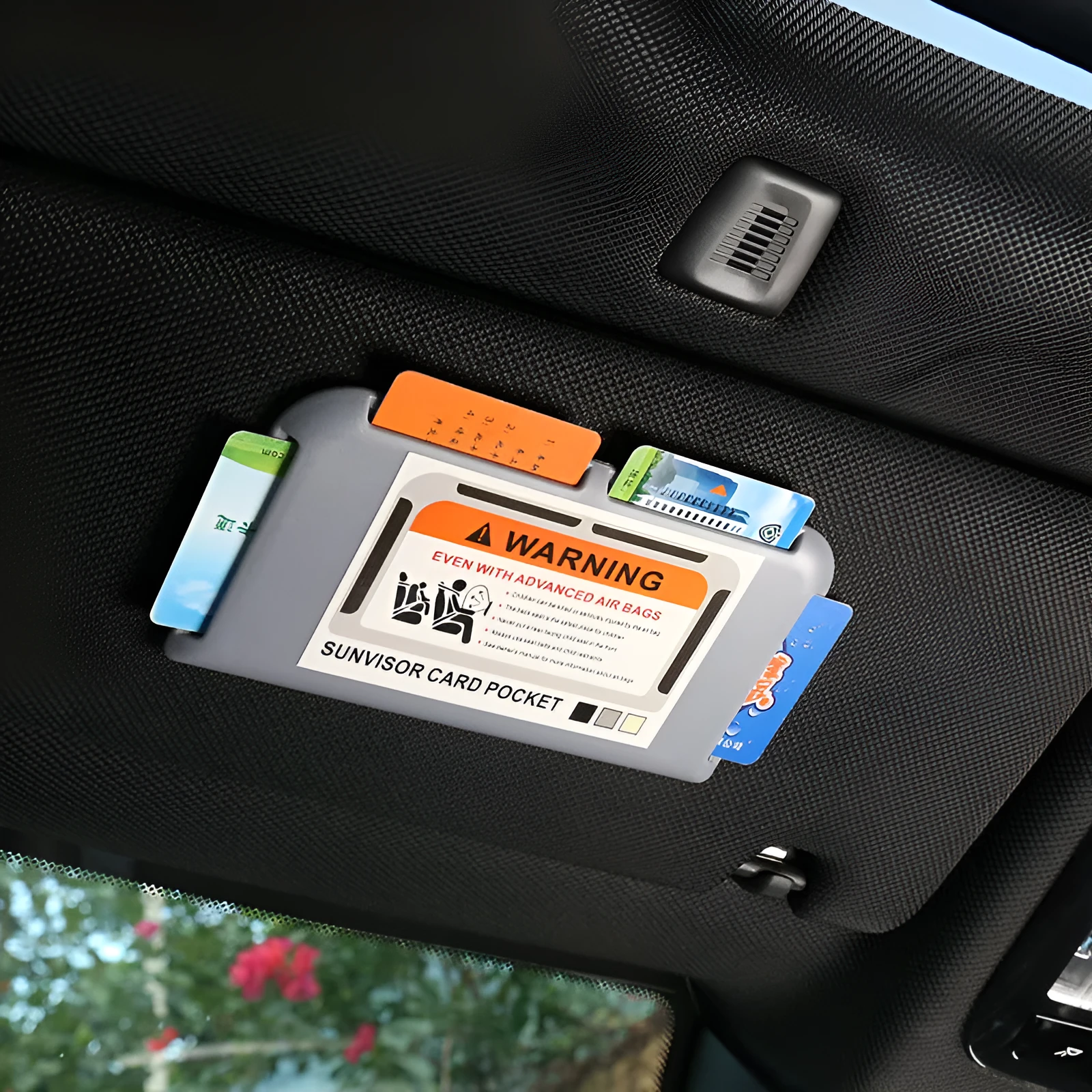 Black car sun visor card holder with four slots for driving licence and parking permits