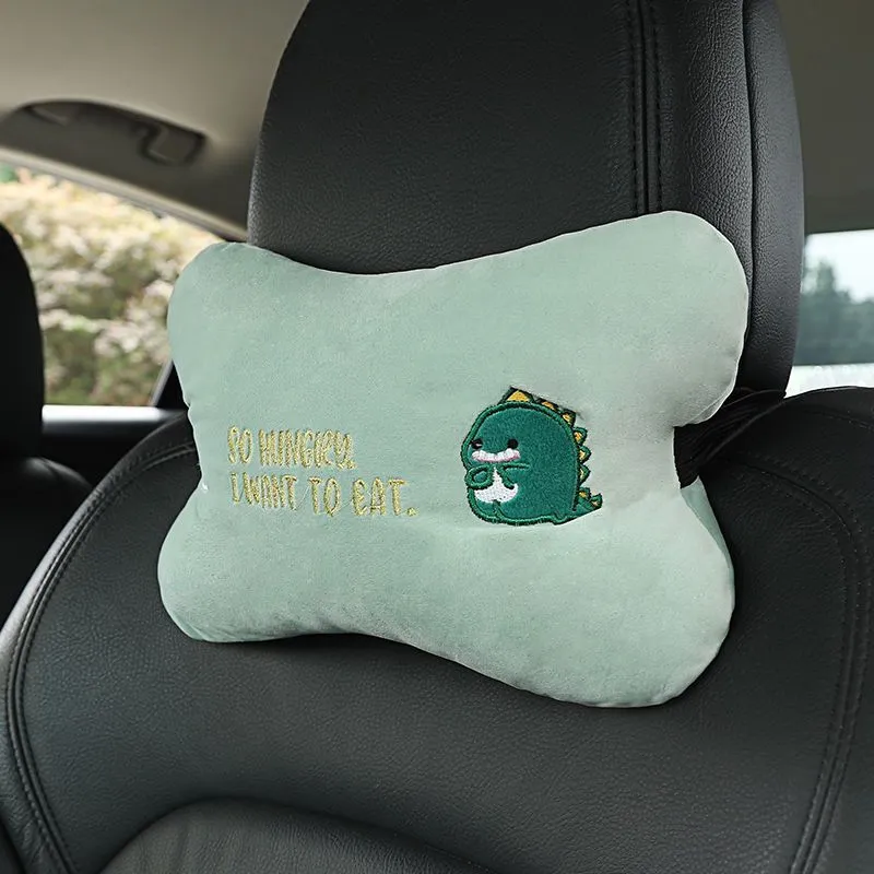 Car plush embroidery headrest shoulder pad with cute lion design in black on a car seat
