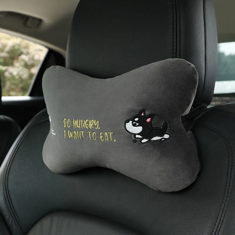 Car plush embroidery headrest shoulder pad with cute lion design in black on a car seat