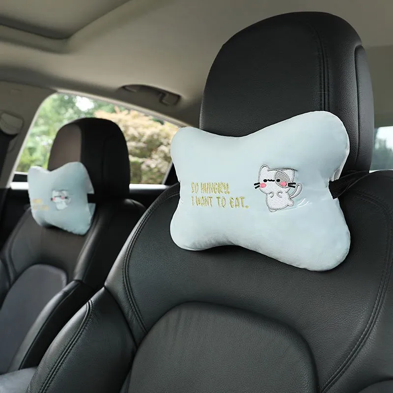 Car plush embroidery headrest shoulder pad with cute lion design in black on a car seat