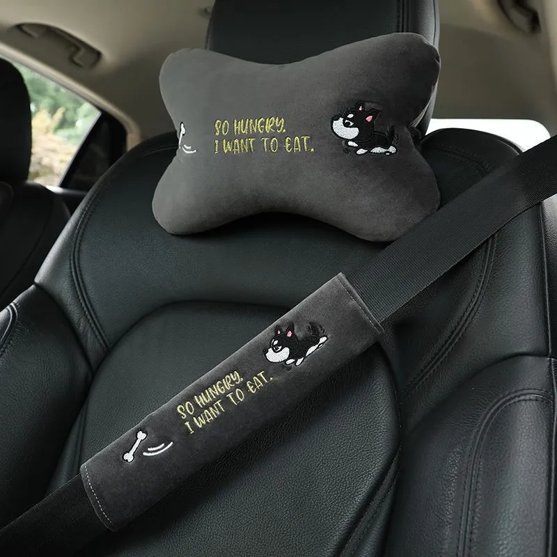 Car plush embroidery headrest shoulder pad with cute lion design in black on a car seat