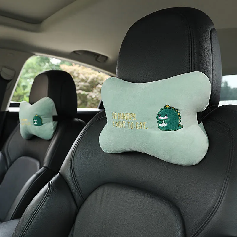 Car plush embroidery headrest shoulder pad with cute lion design in black on a car seat
