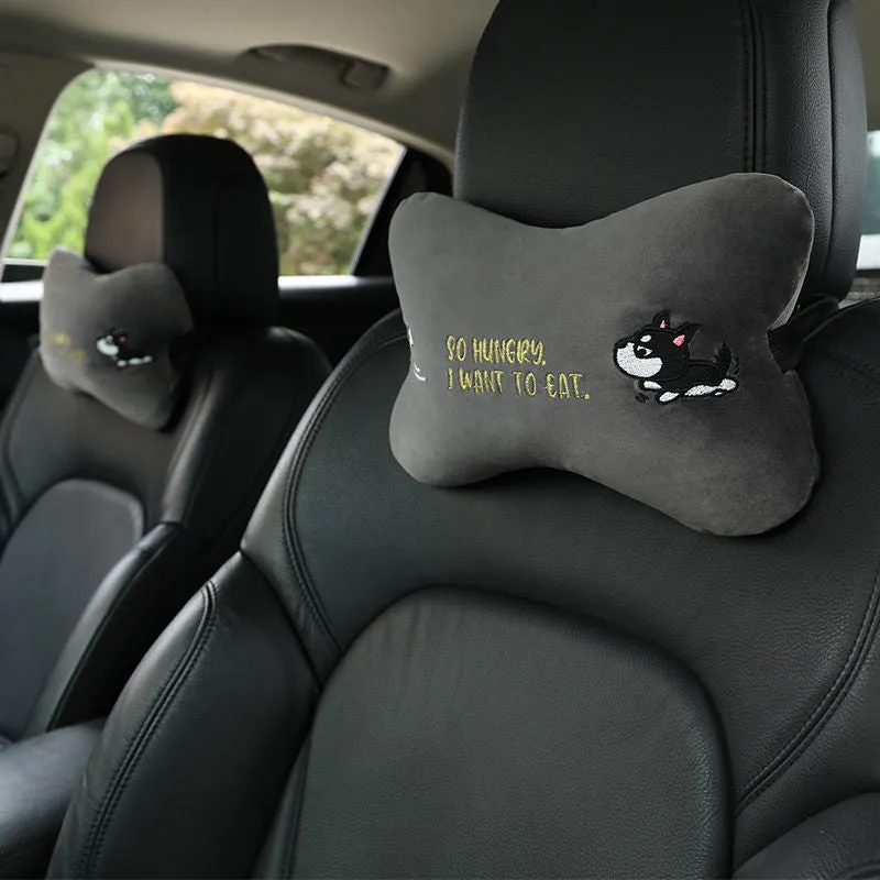 Car plush embroidery headrest shoulder pad with cute lion design in black on a car seat