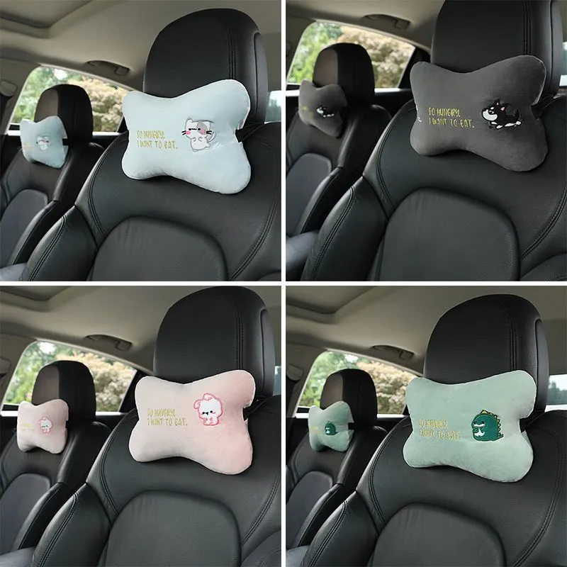 Car plush embroidery headrest shoulder pad with cute lion design in black on a car seat