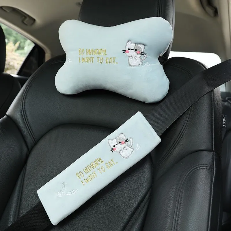 Car plush embroidery headrest shoulder pad with cute lion design in black on a car seat