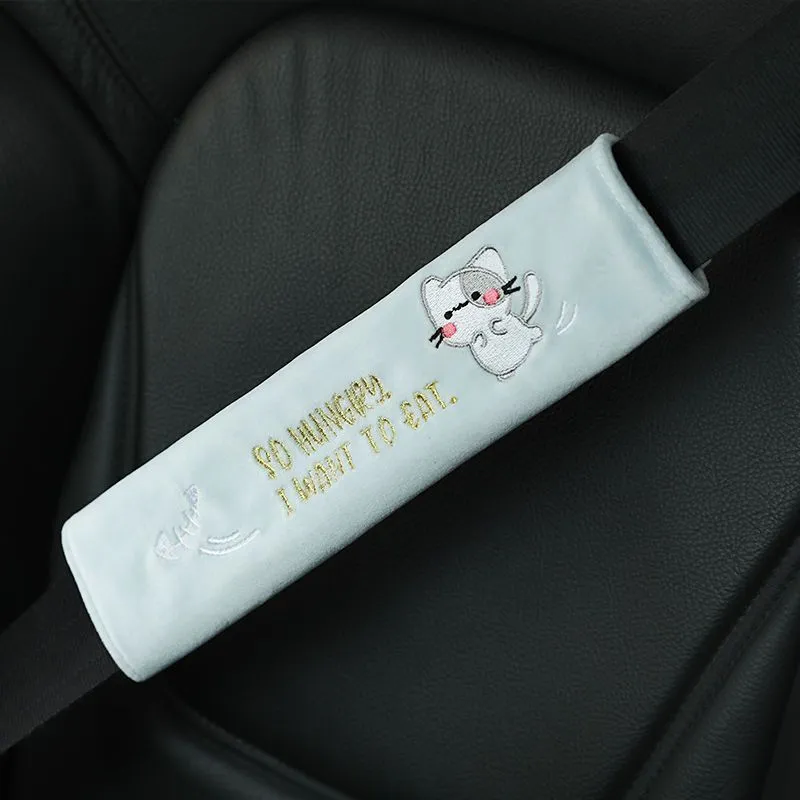Car plush embroidery headrest shoulder pad with cute lion design in black on a car seat