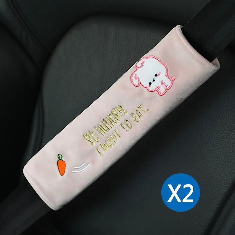 Car plush embroidery headrest shoulder pad with cute lion design in black on a car seat
