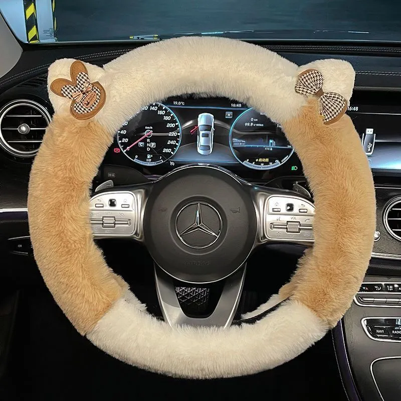 Milk tea white plush steering wheel cover with cute panda ears design on a car steering wheel