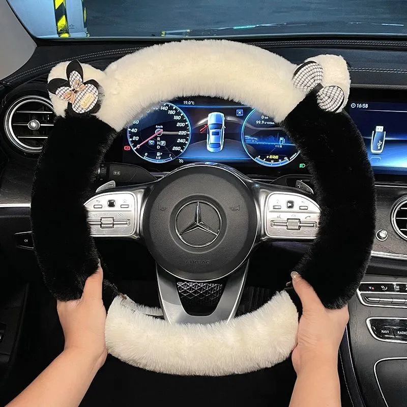 Milk tea white plush steering wheel cover with cute panda ears design on a car steering wheel