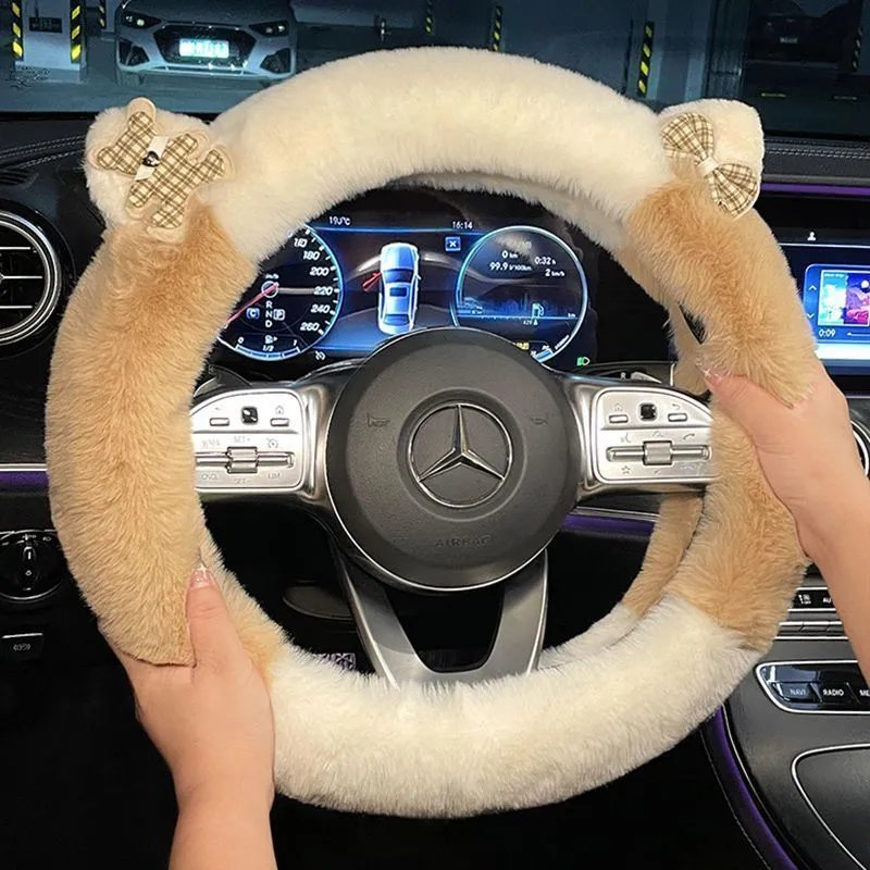 Milk tea white plush steering wheel cover with cute panda ears design on a car steering wheel