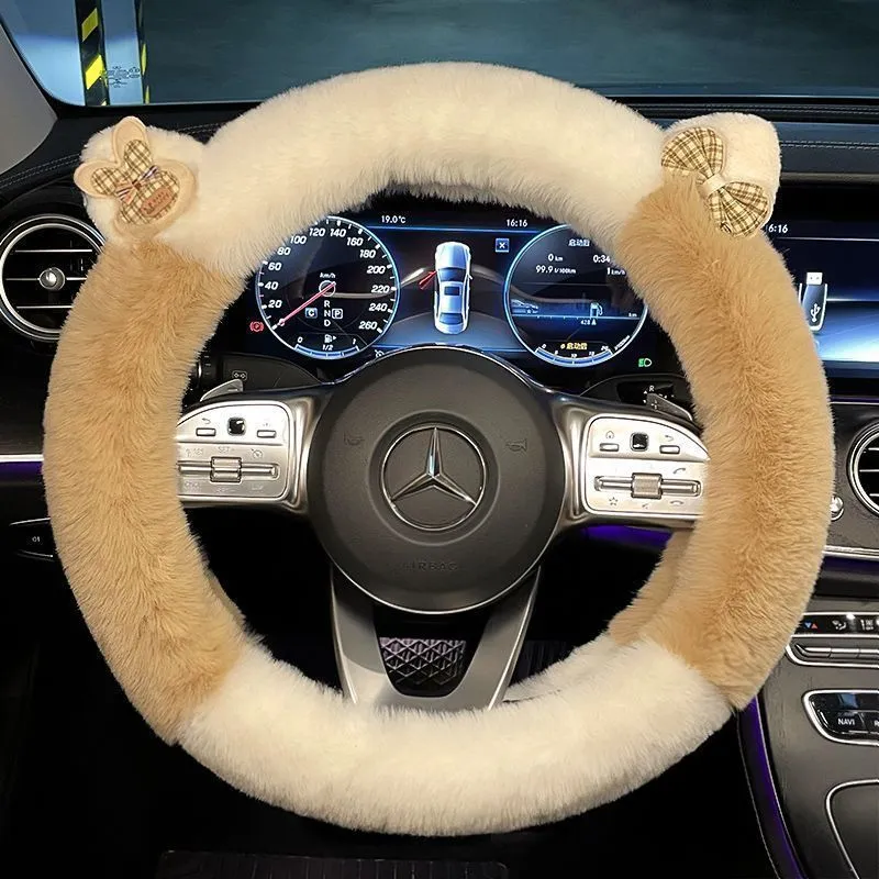 Milk tea white plush steering wheel cover with cute panda ears design on a car steering wheel