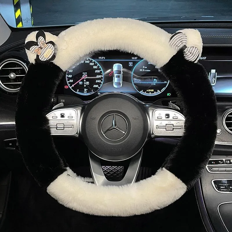 Milk tea white plush steering wheel cover with cute panda ears design on a car steering wheel