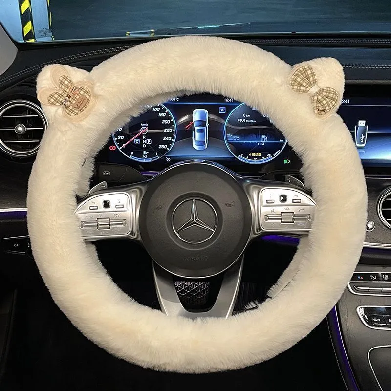 Milk tea white plush steering wheel cover with cute panda ears design on a car steering wheel