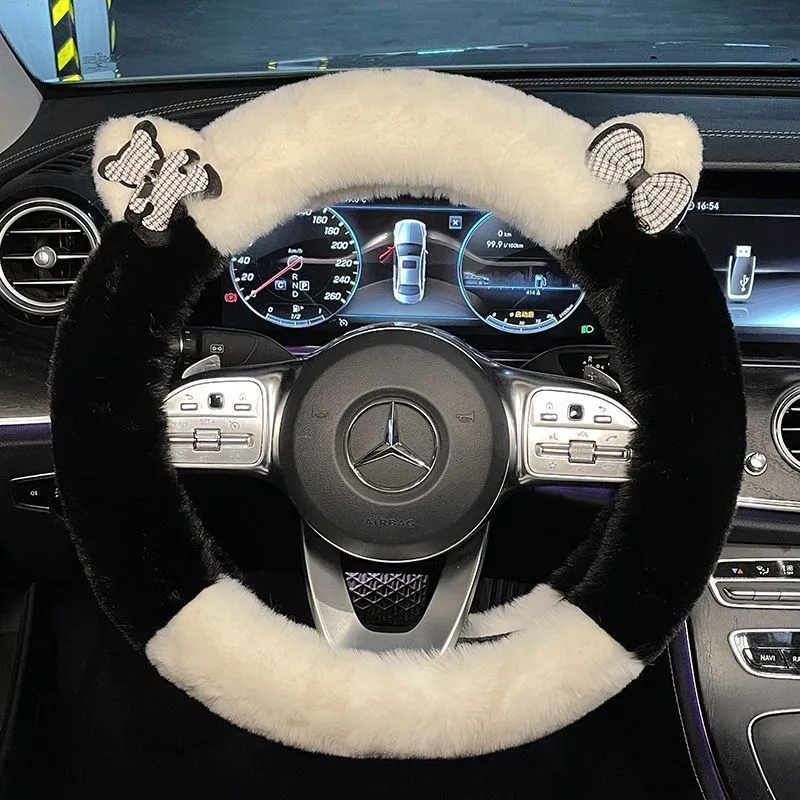 Milk tea white plush steering wheel cover with cute panda ears design on a car steering wheel