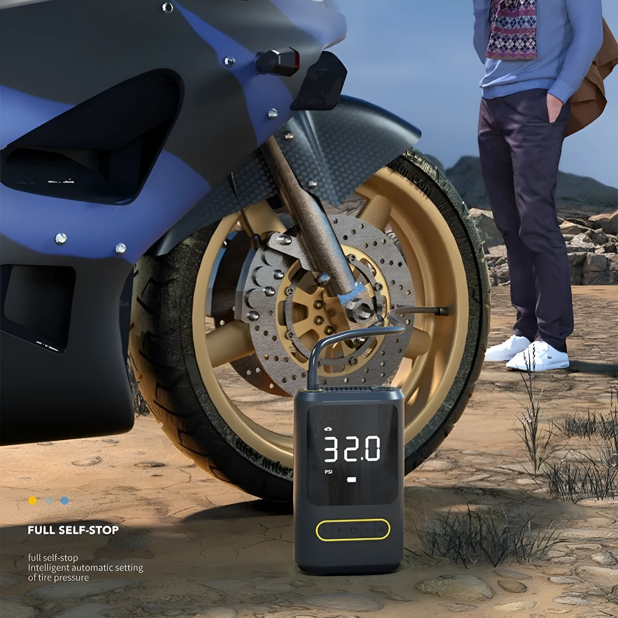 Mini portable wireless car tyre inflator with LED light, black, on a garage floor