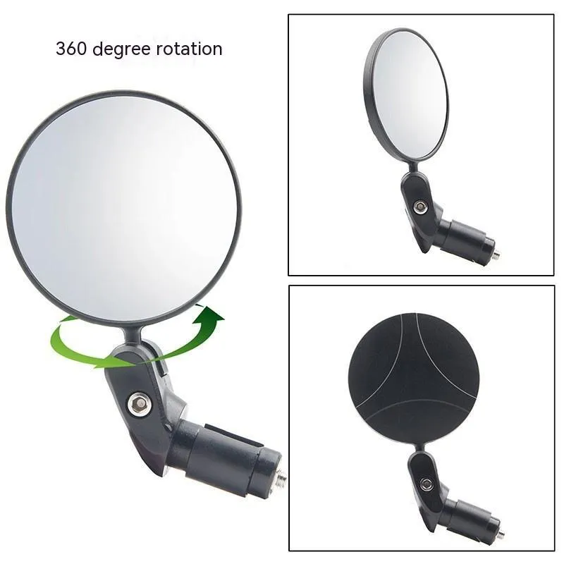 Black foldable convex rearview mirror on a car side mirror, showing its adjustable angle.