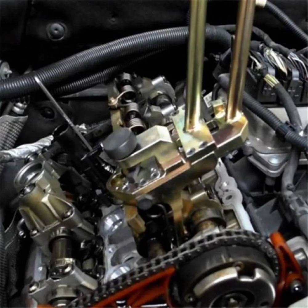 Valve pressure spring dismantling device for BMW engines with aluminium alloy body and steel pliers