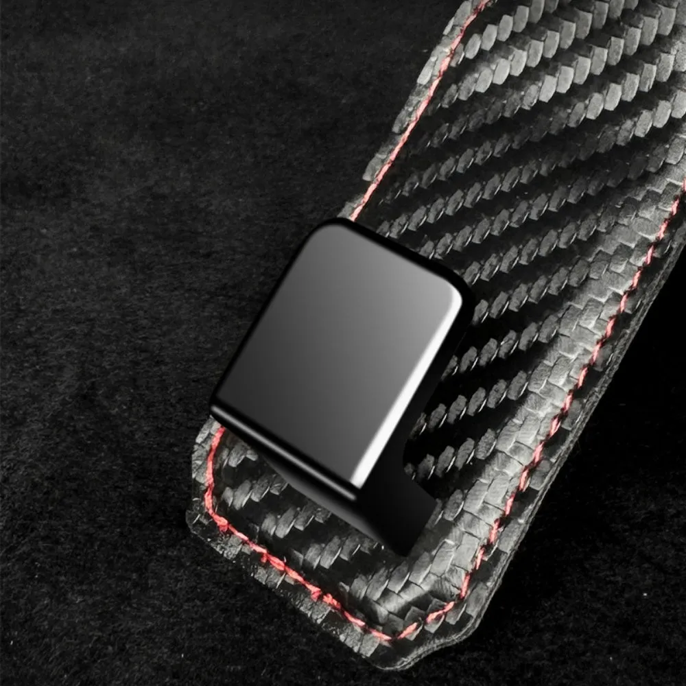 Black carbon fibre metal car hook clipped to headrest with 25kg load capacity