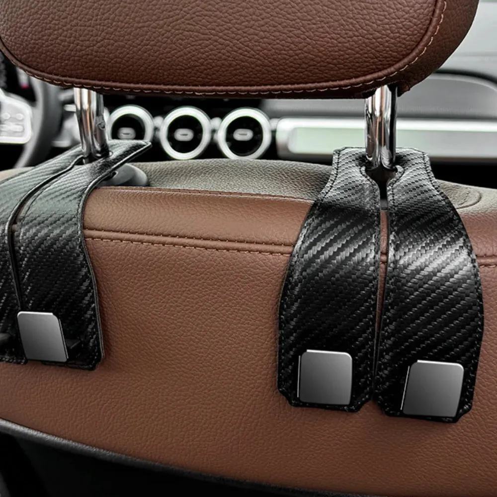 Black carbon fibre metal car hook clipped to headrest with 25kg load capacity