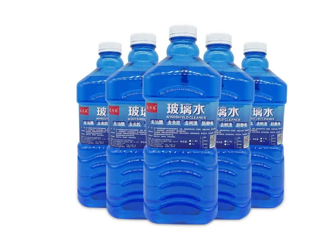 Blue windshield washer fluid in 1.8L bottle with car wiper application
