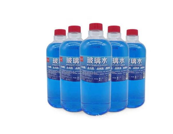 Blue windshield washer fluid in 1.8L bottle with car wiper application