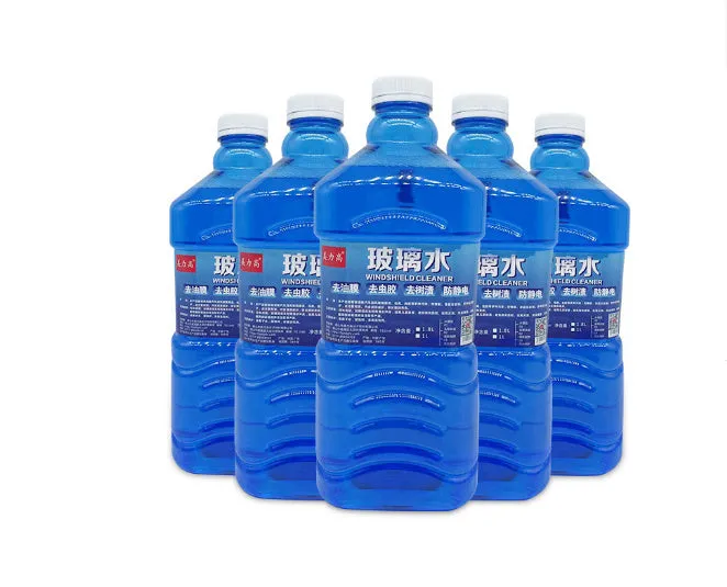 Blue windshield washer fluid in 1.8L bottle with car wiper application