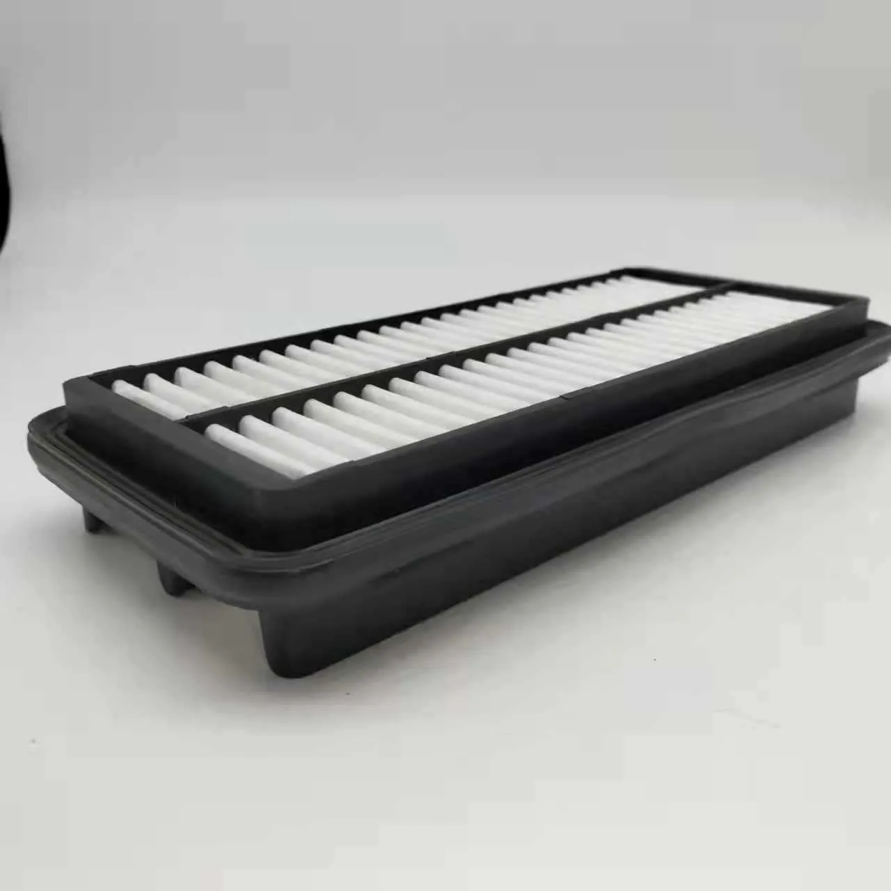 Black rectangular car air filter measuring 256mm by 113mm by 40mm.