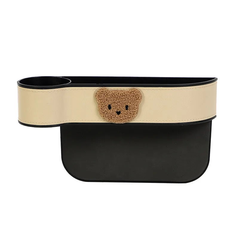 Leather car seat gap storage box with cartoon bear design hanging between vehicle seats