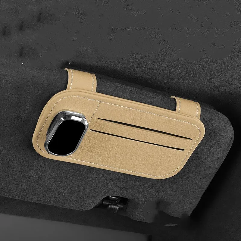 Beige leather car sun visor organiser holding cards and a pair of sunglasses.