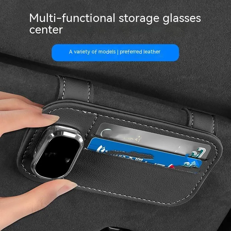 Beige leather car sun visor organiser holding cards and a pair of sunglasses.