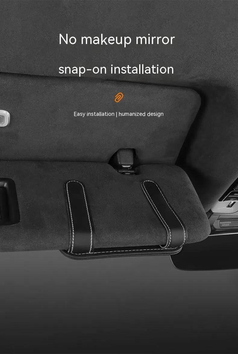 Beige leather car sun visor organiser holding cards and a pair of sunglasses.