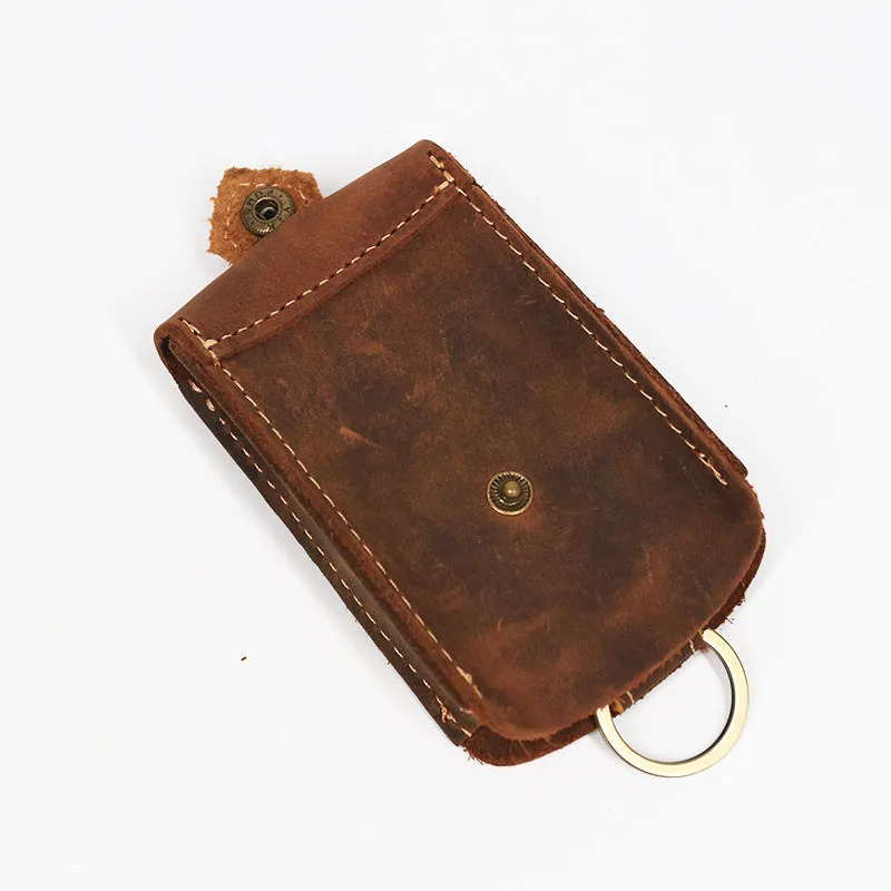 Crazy horse leather key case 7cm by 11.5cm in dark brown colour lying flat