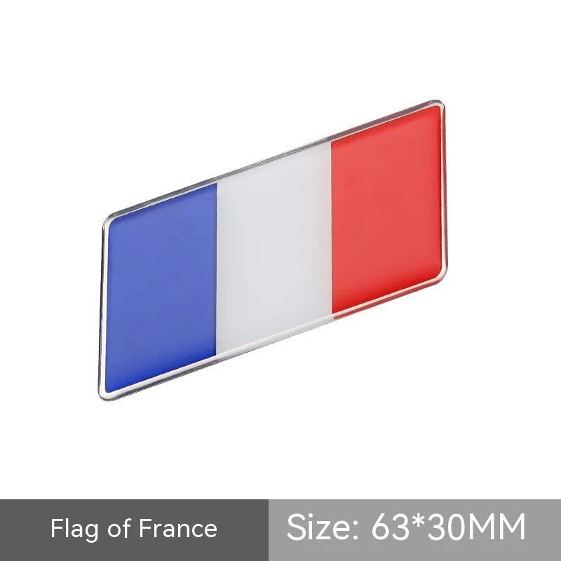 Aluminium national flag car sticker with metal crystal tail tag measuring 6.3cm by 3cm showing parallelogram shape