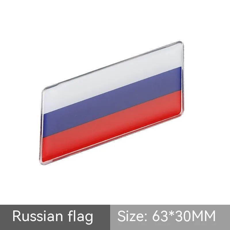 Aluminium national flag car sticker with metal crystal tail tag measuring 6.3cm by 3cm showing parallelogram shape