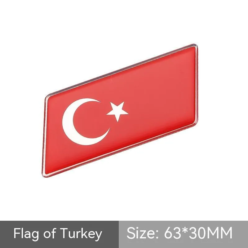 Aluminium national flag car sticker with metal crystal tail tag measuring 6.3cm by 3cm showing parallelogram shape